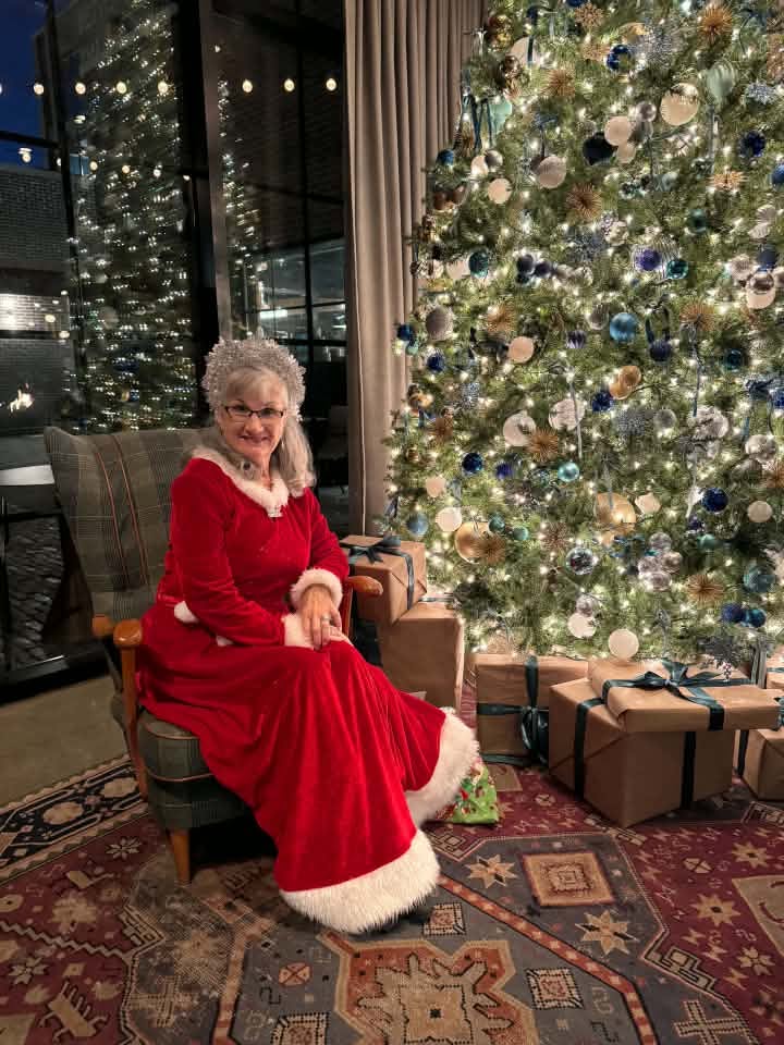 Mrs. Claus in a detailed red and white gown