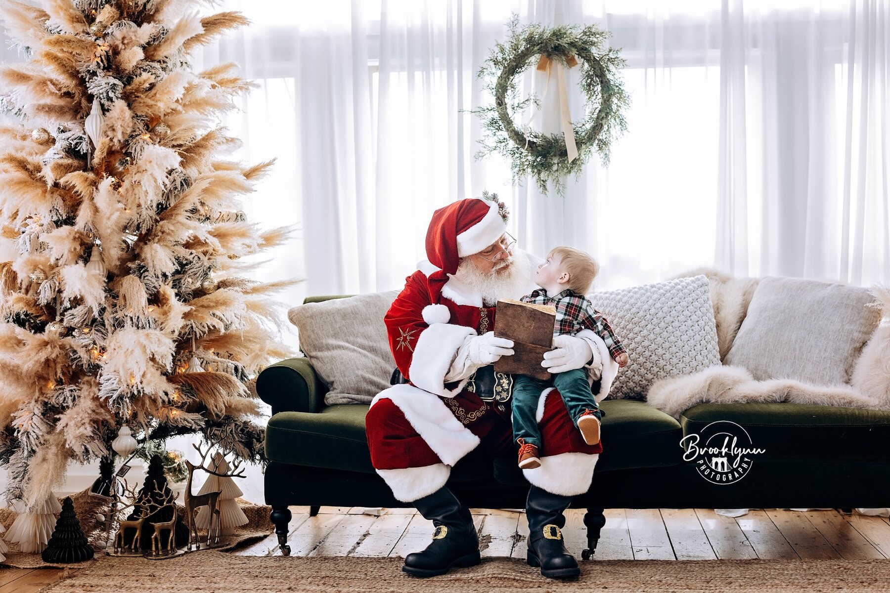 Santa sharing a quiet conversation with a young child